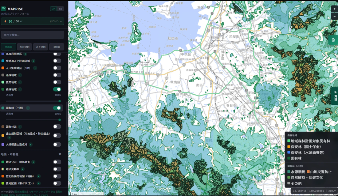 Zoomed-in map of the Minami-ku, Fukuoka City / Naka-gawa City area. The National Forest (Sub-compartments) layer's black-outlined polygons — color-coded teal for watershed conservation and orange for mountain disaster prevention — stand out as precise parcels within the Forest Area layer's broader green and light-blue fill