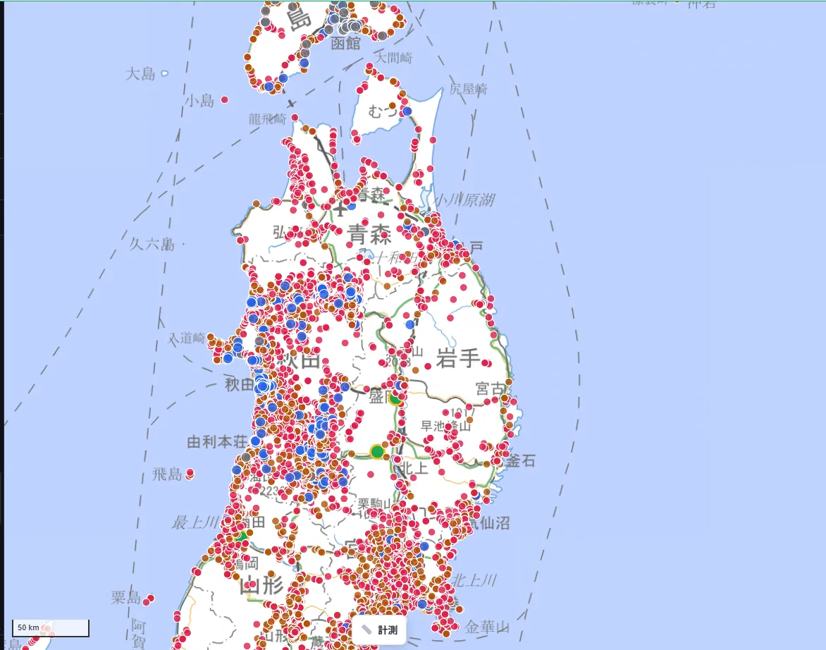 A wide-area map of the Tohoku region — Aomori, Akita, Iwate, and Yamagata prefectures — showing shrines (red) and temples (orange), with a dense cluster of Christian churches (blue) within Akita Prefecture.