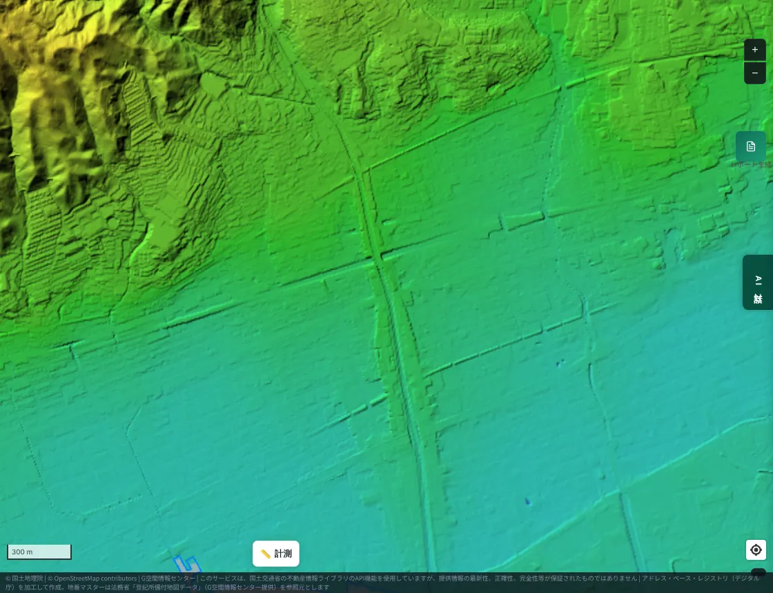 A color-coded elevation map near Ashiya City, Hyogo. From the high yellow-green to yellow land on the mountain side toward the low blue-green seaside, the Ashiya River extends north to south as a thin line